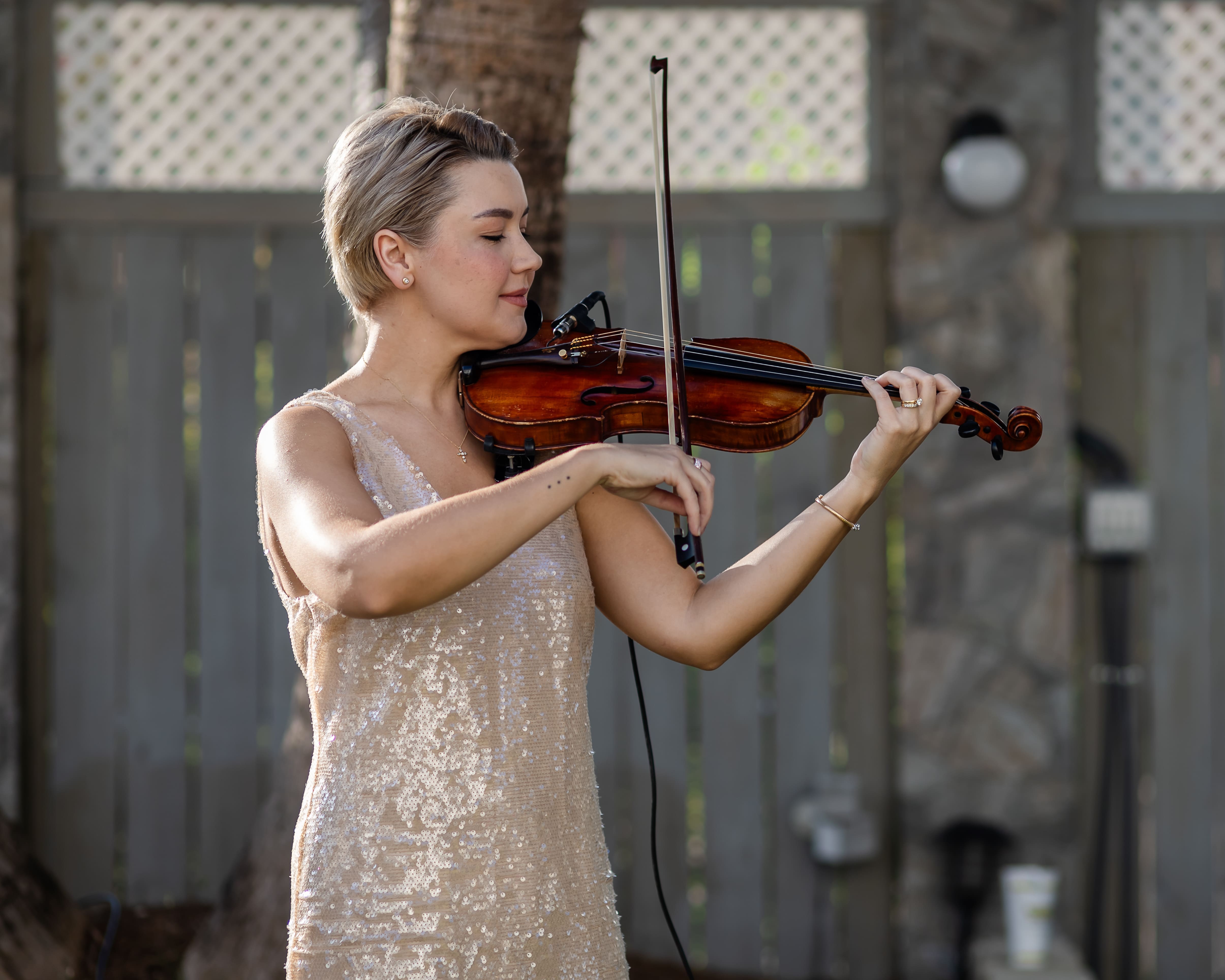 Violinist performing at a Canal Street Inn event in New Orleans