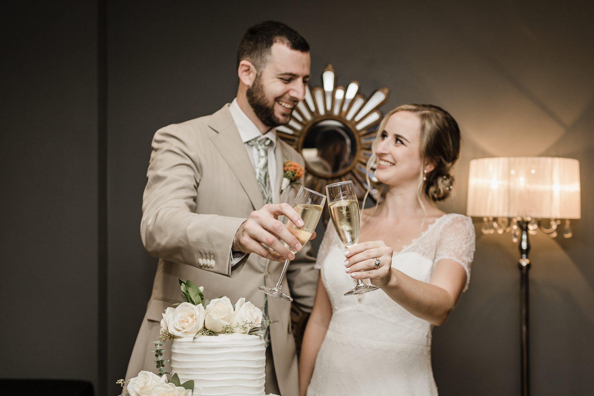Newlyweds sharing a champagne toast at Canal Street Inn
